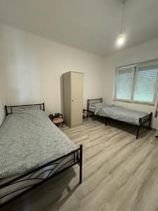 Twin room B with shared bathroom