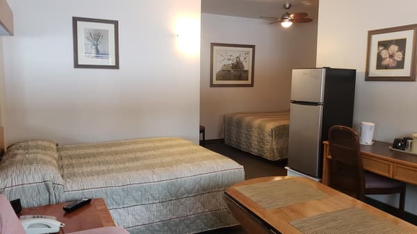 Two - Queen Beds with Couch ( No Pets allow )