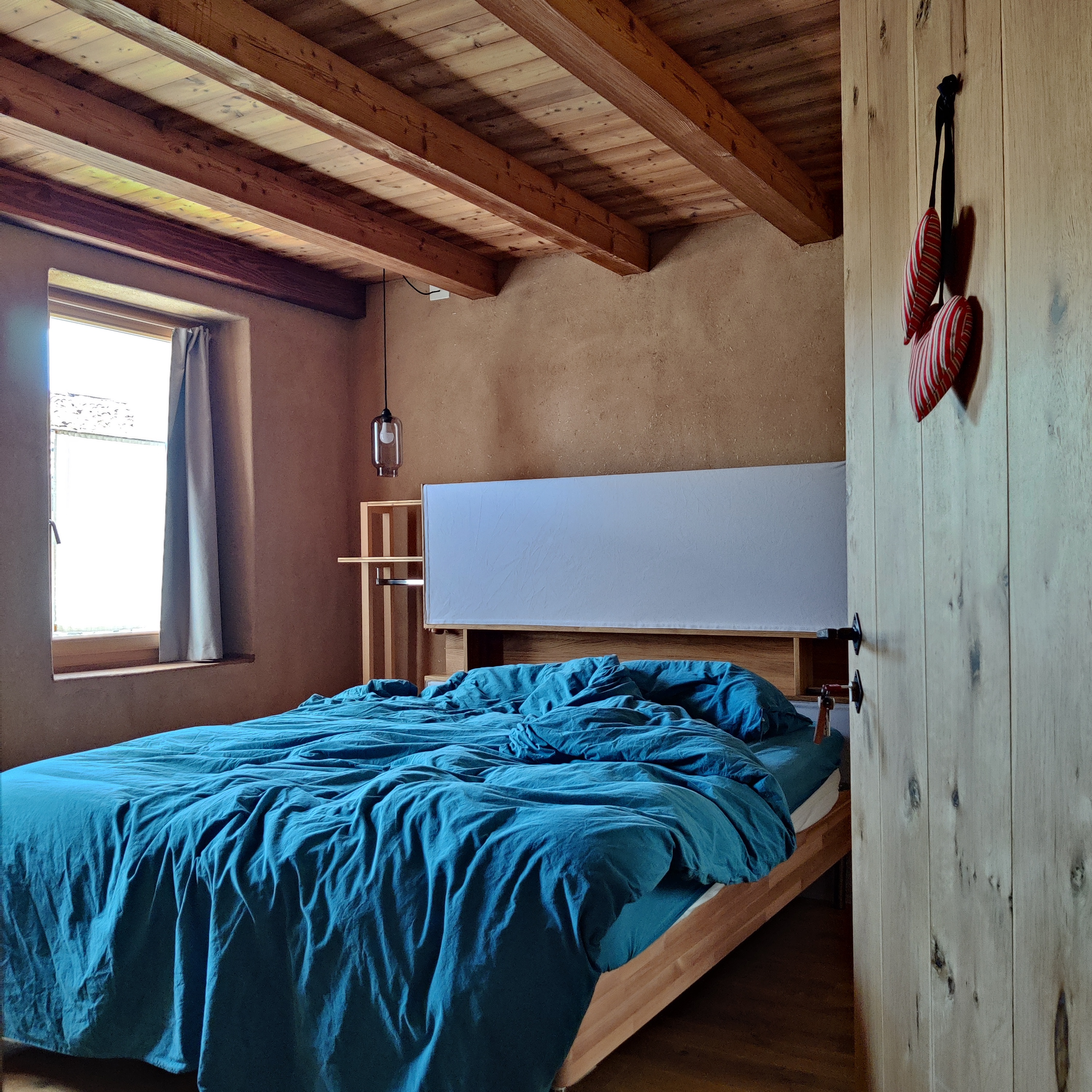 Camera matrimoniale "Colmeda" · Camera matrimoniale argilla&paglia